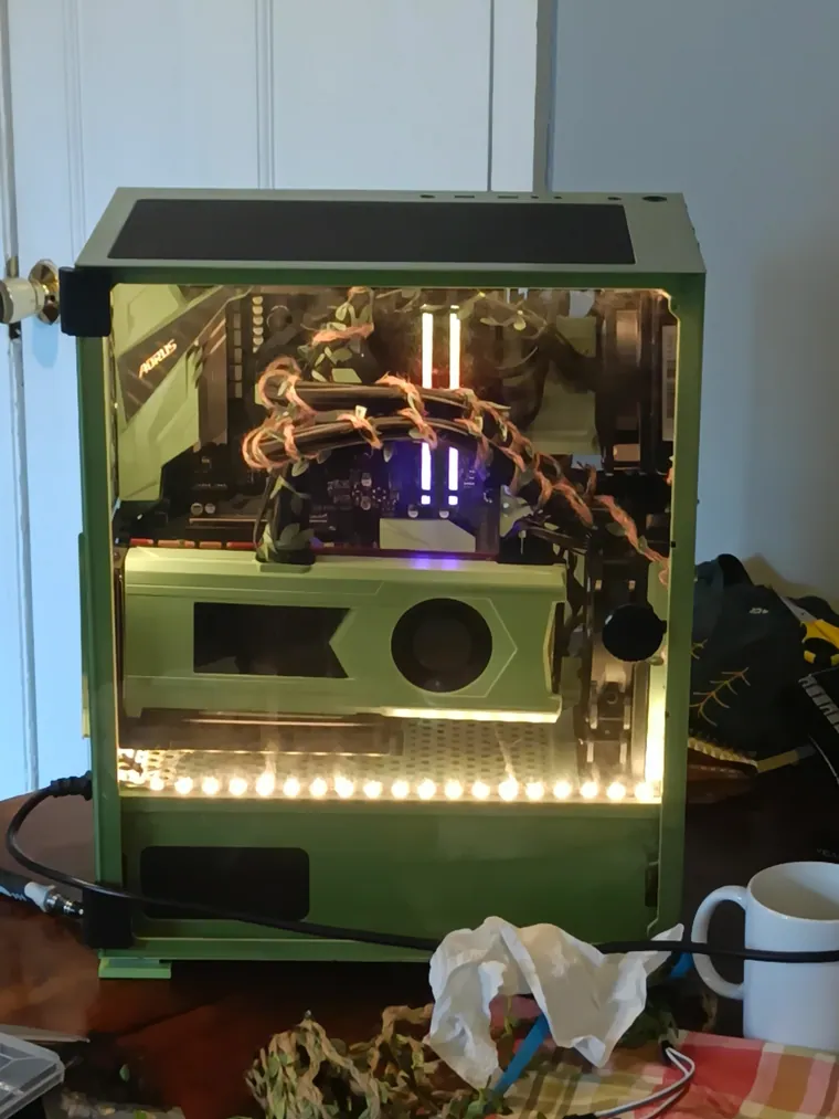 Green Machine build in a tempered glass case with light strips.