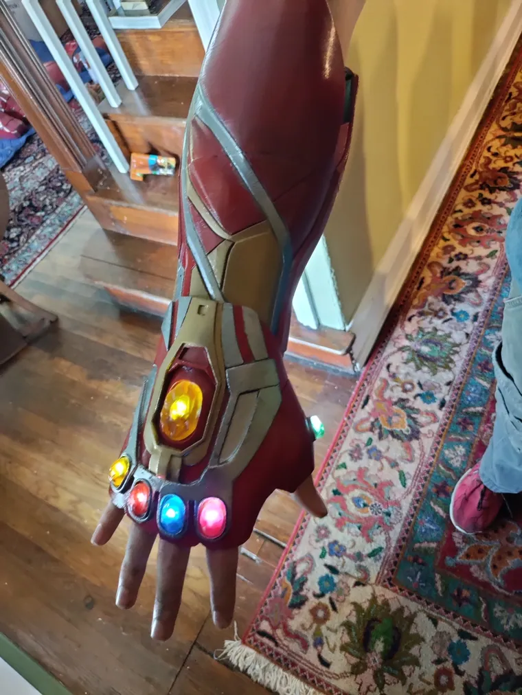 Gauntlet with lit stones.