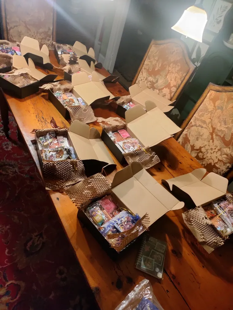 Boxes lined up along a table during packing.
