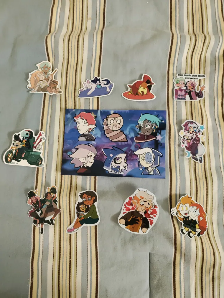 Die cut stickers arranged around a print.